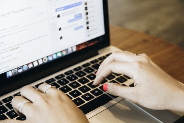 Woman Browsing the Internet on A Laptop. Concept for Research Accredited Certification Programs